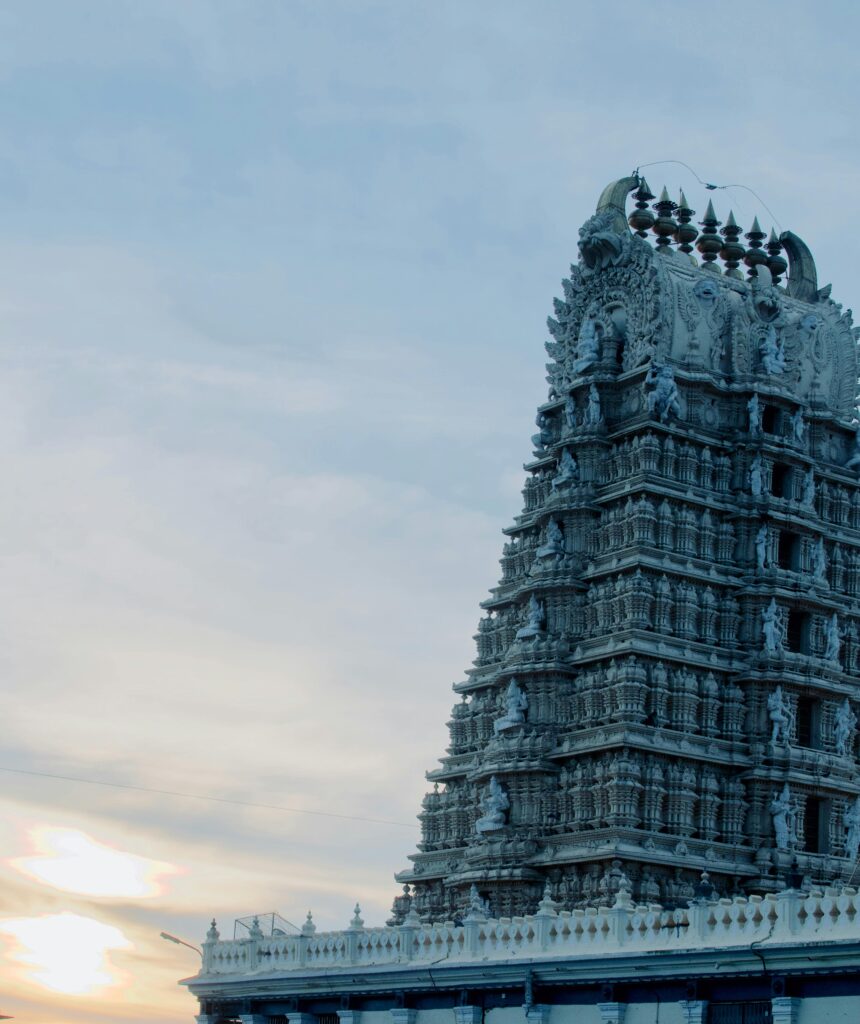 Beautiful South Indian temple with intricate carvings, showcasing traditional architectural brilliance.